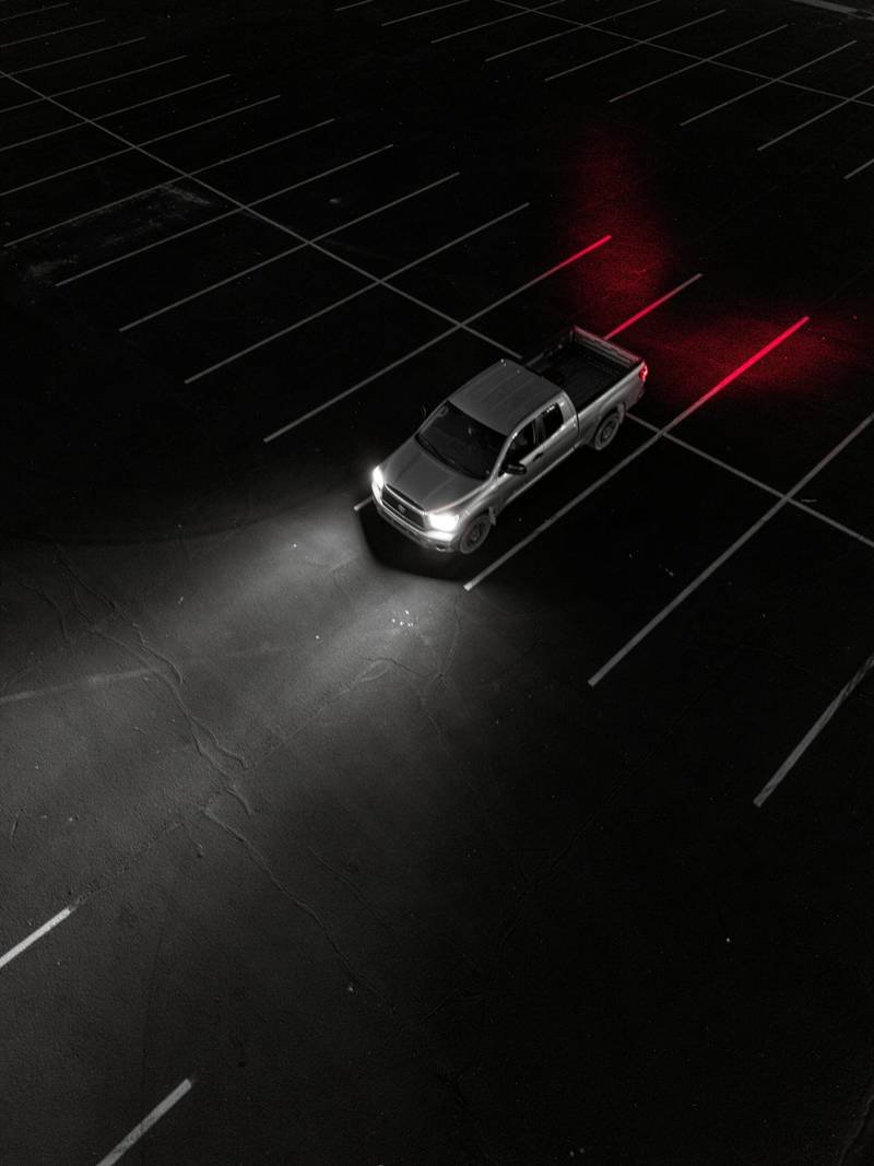 a car parked in the middle of a parking lot