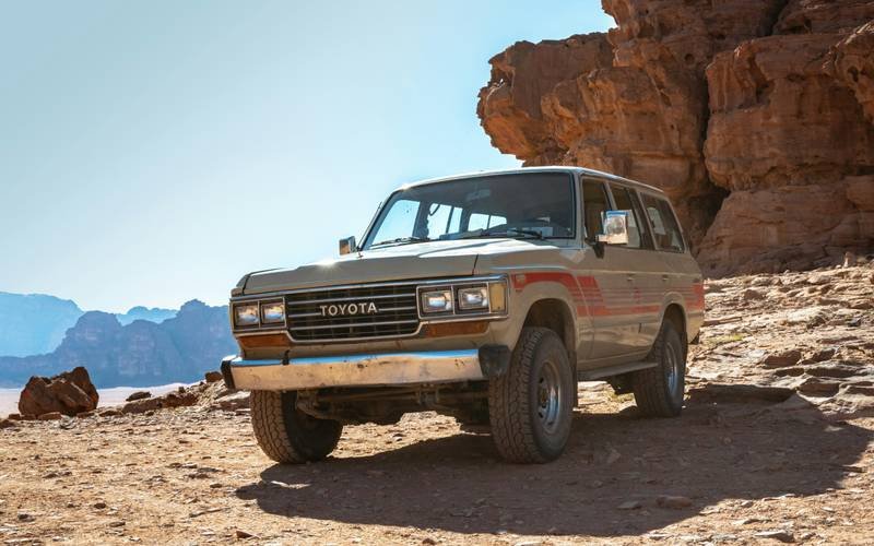 silver Toyota Land Cruiser parked on ground during daytime